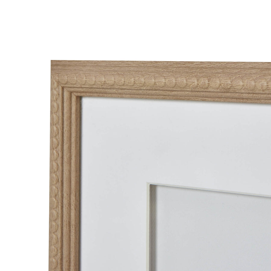Black coral silhouette artwork on white, framed in natural wood with beaded detailing, 40cm coastal wall decor by Sostter at brixbailey.com