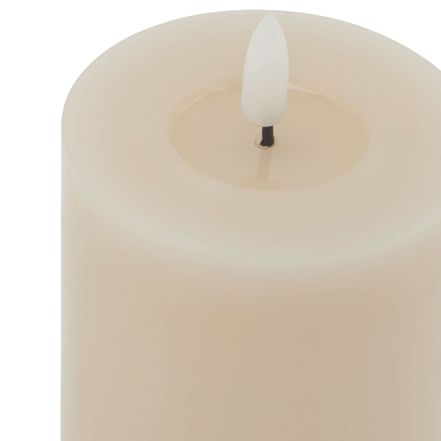 Taupe LED wax candle with realistic melt effect, flickering flame, and minimalist design for safe home ambiance by Sostter at brixbailey.com