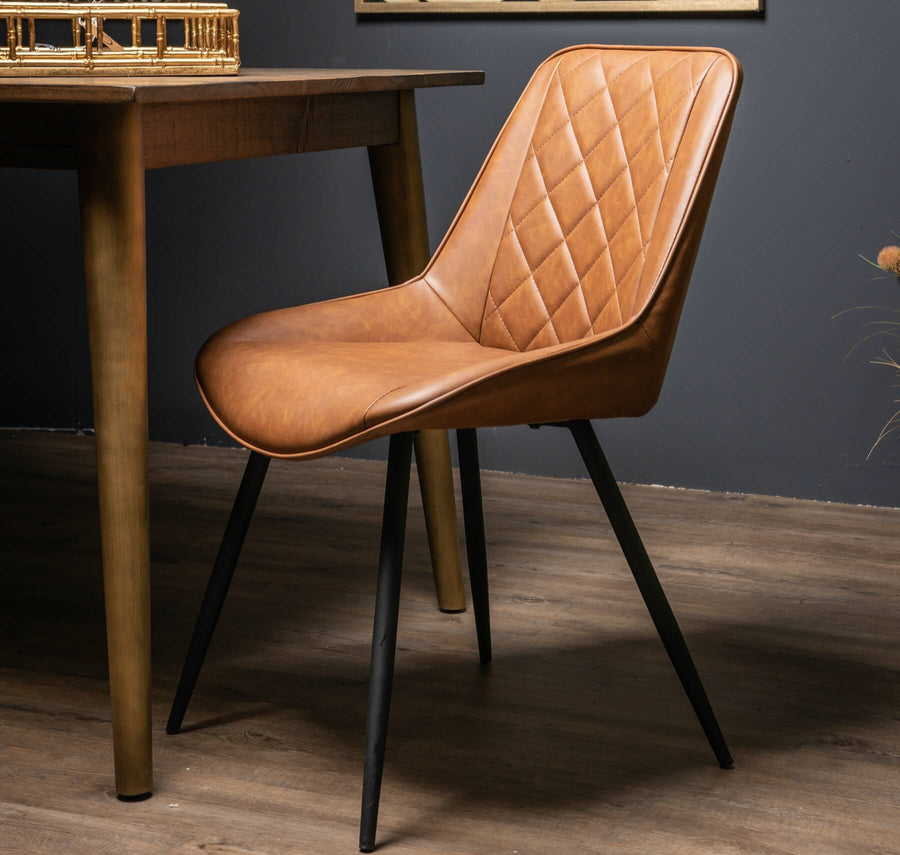 Scandinavian dining chair with diamond-stitched tan upholstery and metal frame in rich brown by Sostter at brixbailey.com