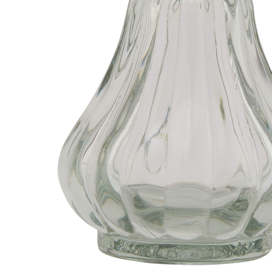 Clear glass bud vase with minimalist cylindrical design for single stems or small floral arrangements by Sostter at brixbailey.com