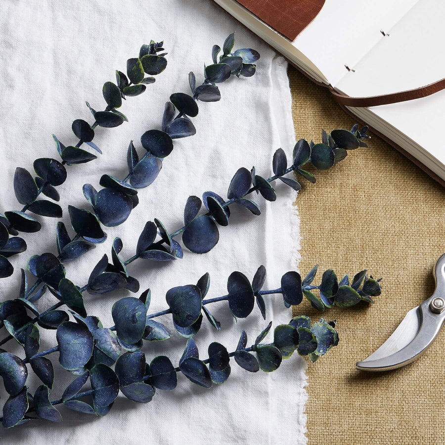Blue eucalyptus stem, 31-inch artificial floral decor in soothing blue, lifelike plastic foliage for home centerpieces by Sostter at brixbailey.com