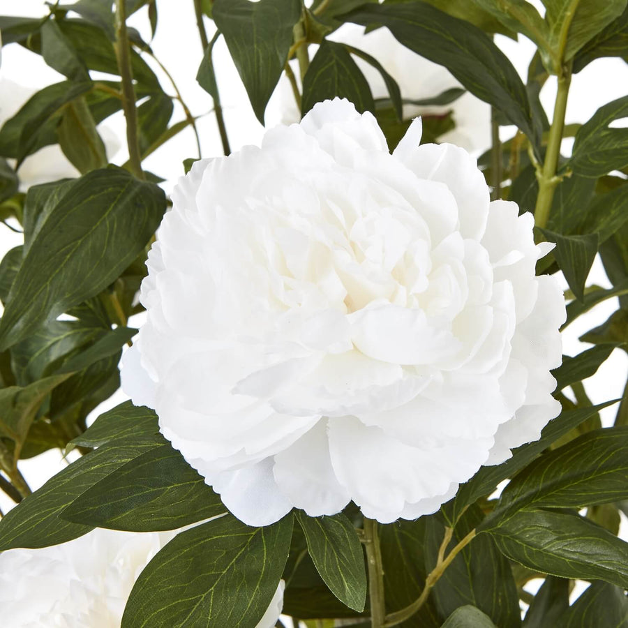 Lifelike white faux peony bush with lush green foliage, perfect for home decor centerpiece or mantel display. by Sostter at brixbailey.com