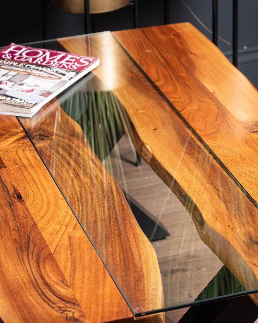 Live edge river dining table with tempered glass center and warm brown wood, modern rustic design by Sostter at brixbailey.com