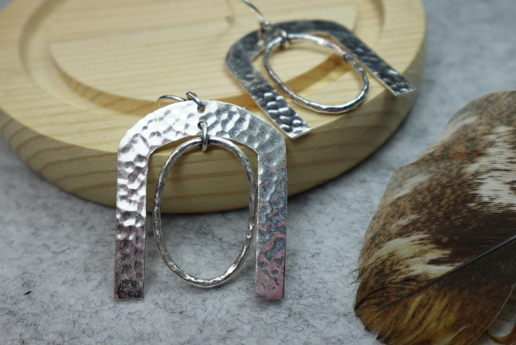 Hammered Horseshoe Brass Earrings - Statement earrings with a bold arch and hammered finish in gold-tone brass.