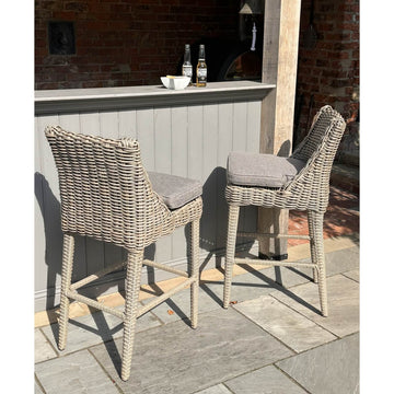 Beige Amalfi outdoor bar stool with powder-coated metal frame, 110cm height, for patio or garden seating by Hill Interiors at brixbailey.com