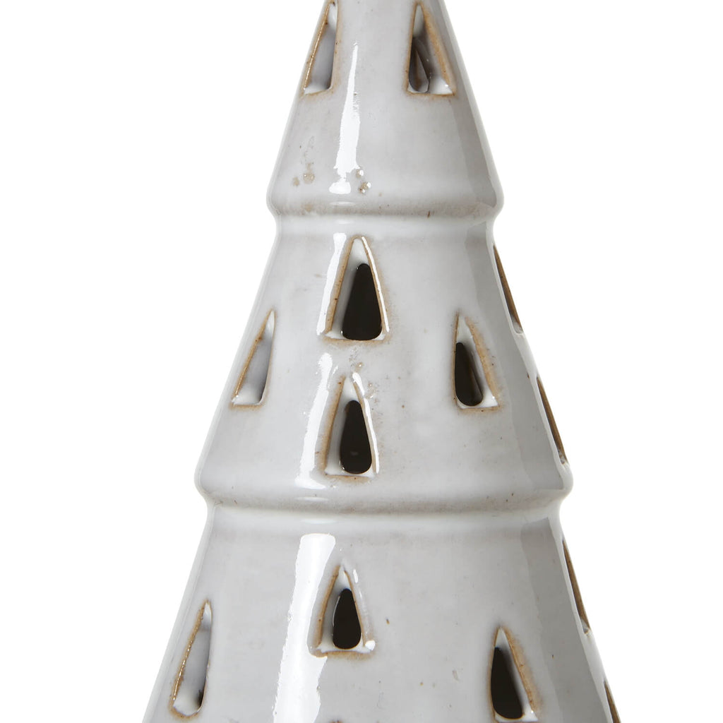 Handcrafted white ceramic LED tree with intricate cut-out patterns, casting warm ambient light for minimalist decor. by RoomLondon at brixbailey.com