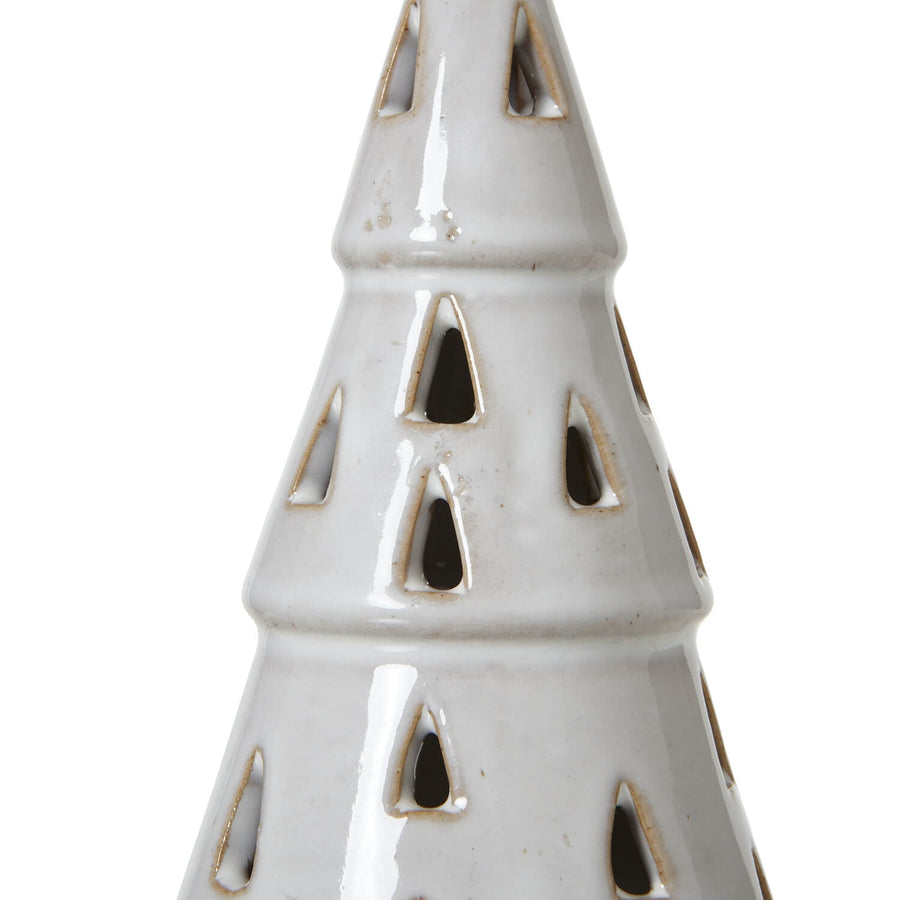 Handcrafted white ceramic LED tree with intricate cut-out patterns, casting warm ambient light for minimalist decor. by Sostter at brixbailey.com
