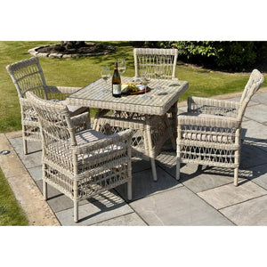 Provence 4-seater outdoor dining set in beige HDPE rattan with tempered glass table and Olefin cushions by sostter at brixbailey.com