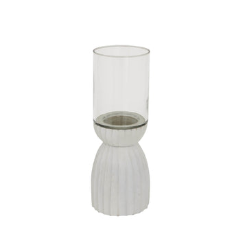 Handcrafted white hurricane lantern with intricate carved patterns, casting ambient light for home decor. by Sostter at brixbailey.com