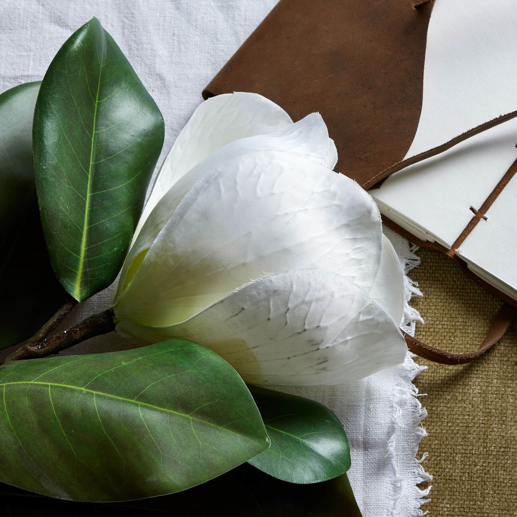 Lifelike white magnolia stem with intricate veining, premium plastic, 78cm tall for elegant home decor arrangements by RoomLondon at brixbailey.com
