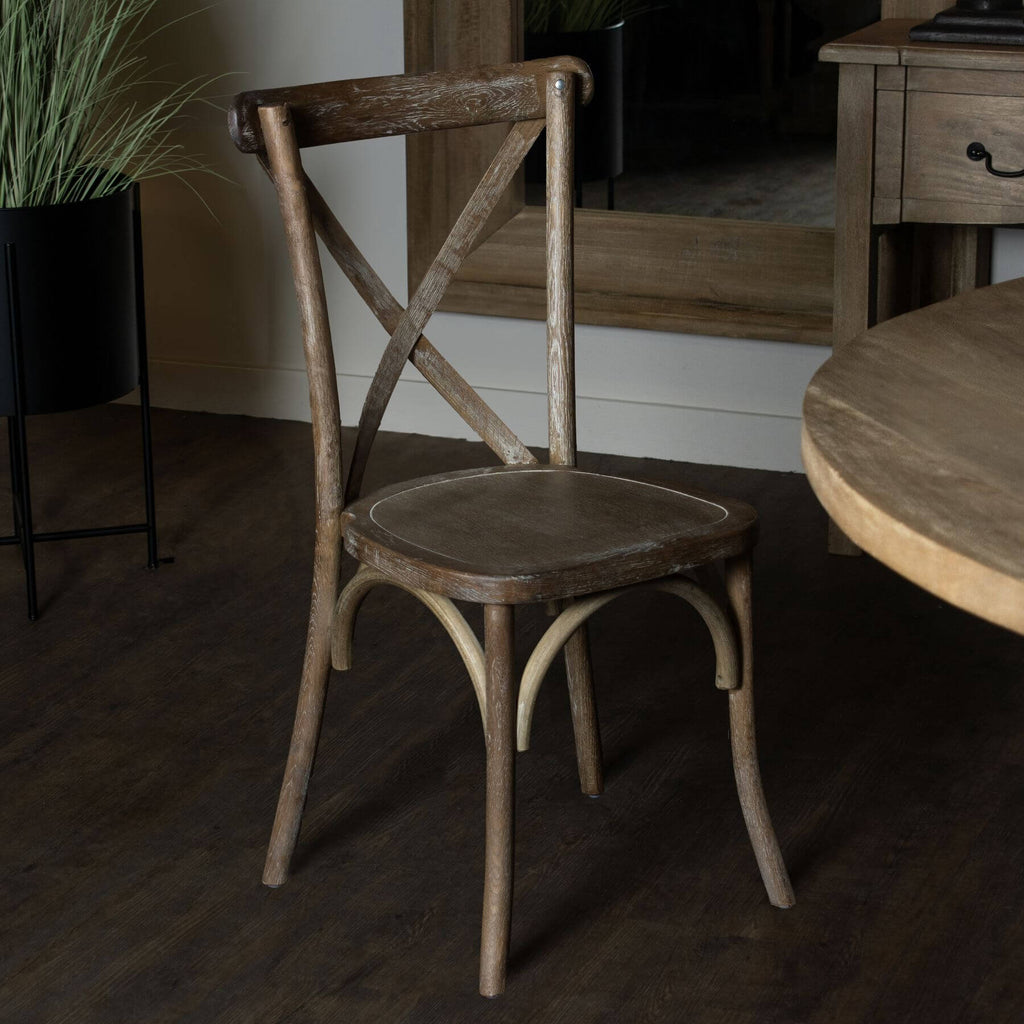 Light oak cross back dining chair with solid oak construction and rustic-modern design for elegant dining spaces. by Sostter at brixbailey.com