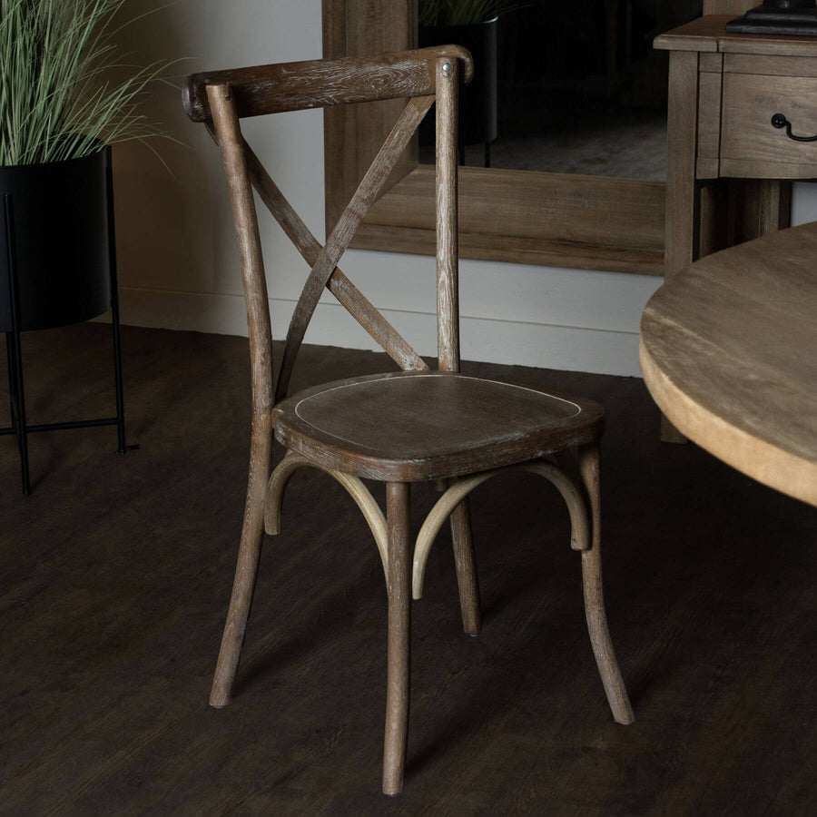Light oak cross back dining chair with solid oak construction and rustic-modern design for elegant dining spaces. by Sostter at brixbailey.com