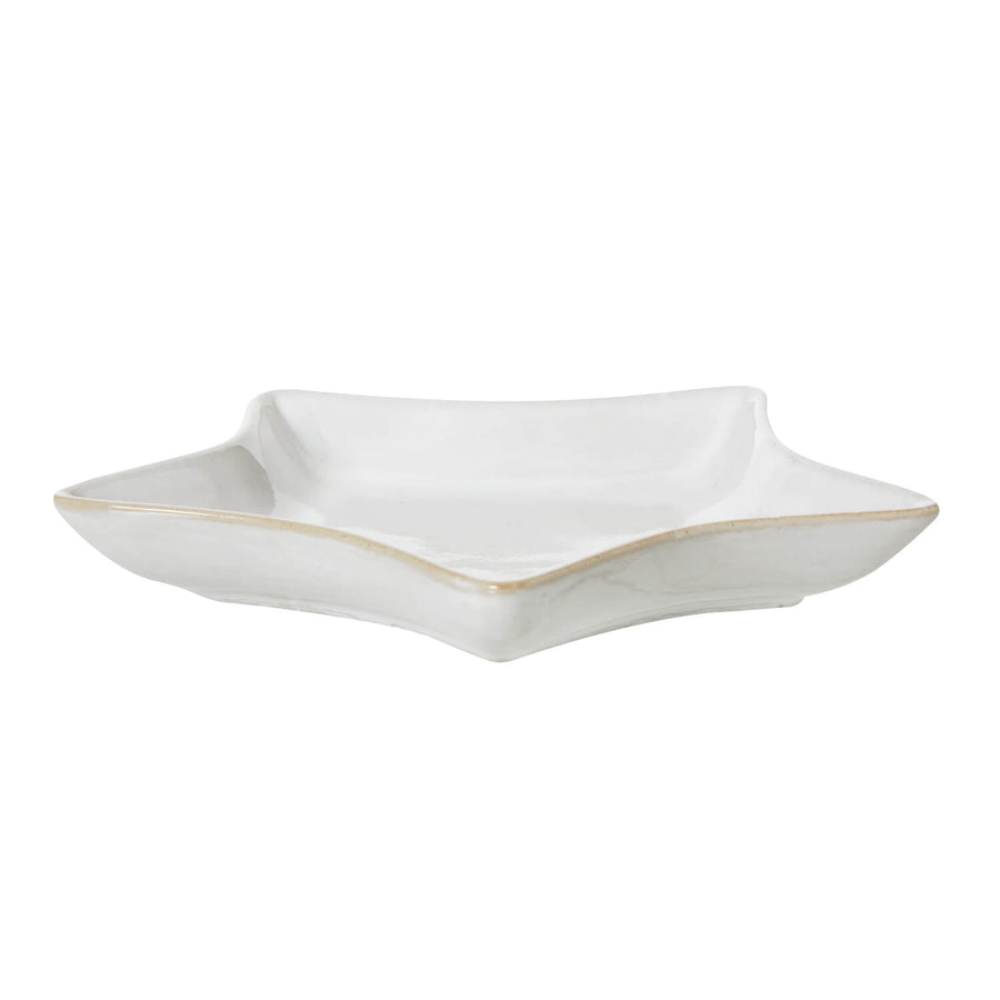 Minimalist white ceramic star dish for home dÃ©cor, handcrafted with smooth edges and luminous finish. by Sostter at brixbailey.com
