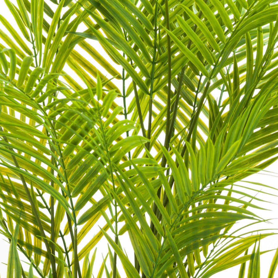 Lifelike faux palm tree in vibrant green with realistic fronds, housed in a modern grey square container, 130cm tall. by Sostter at brixbailey.com