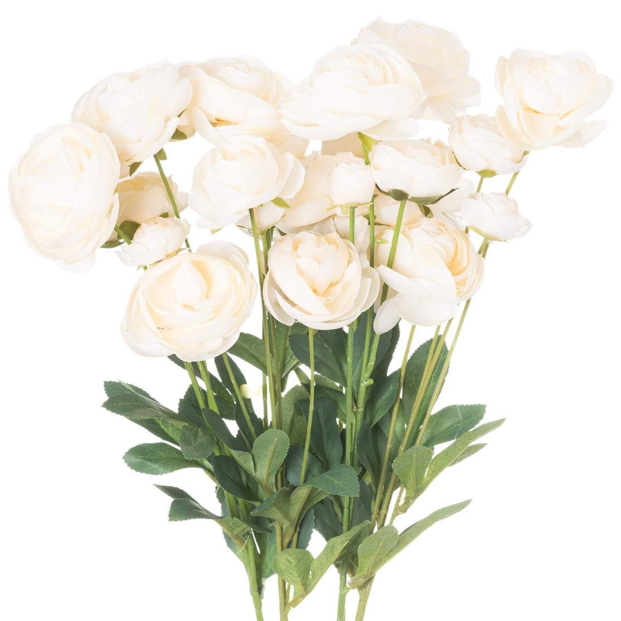 Creamy white faux ranunculus flower with green leaves, hyper-realistic artificial floral decor for home or office. by Sostter at brixbailey.com