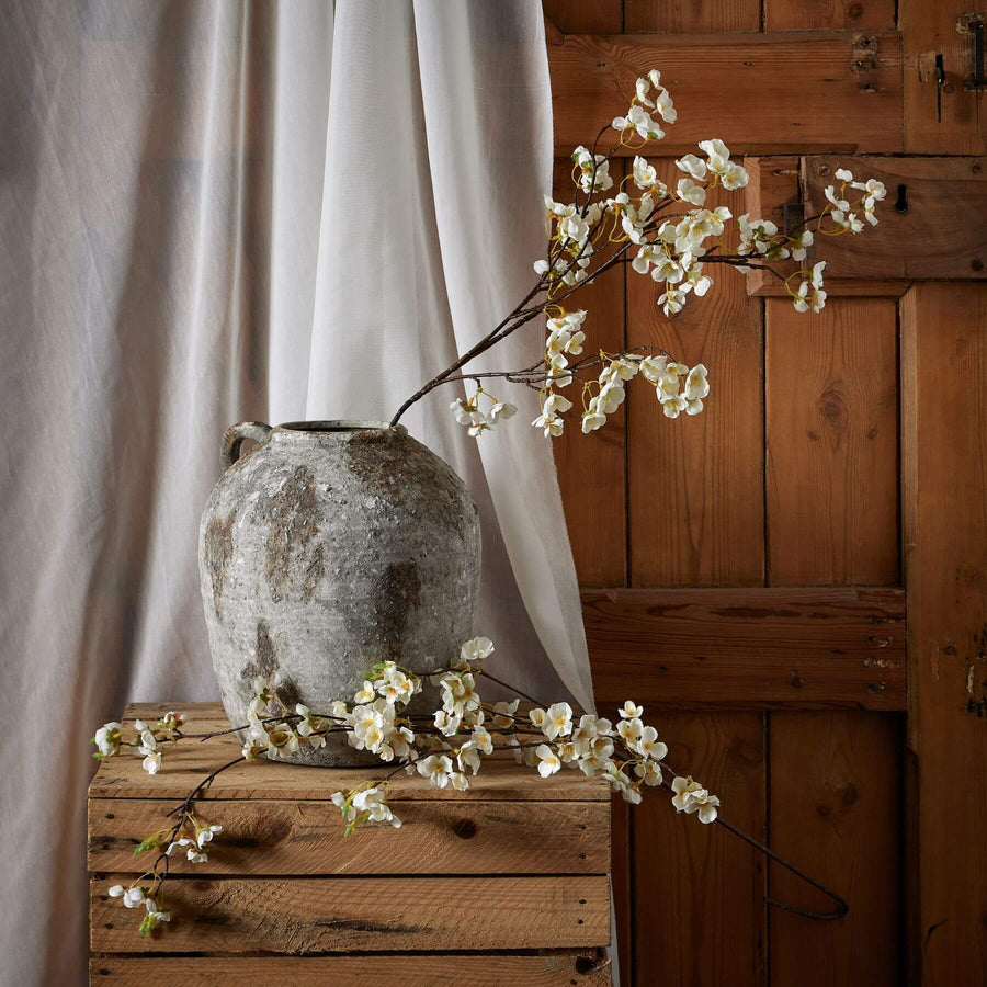 White Japanese-inspired artificial blossom stem with hyper-realistic petals, 130cm tall, for elegant home decor by Sostter at brixbailey.com