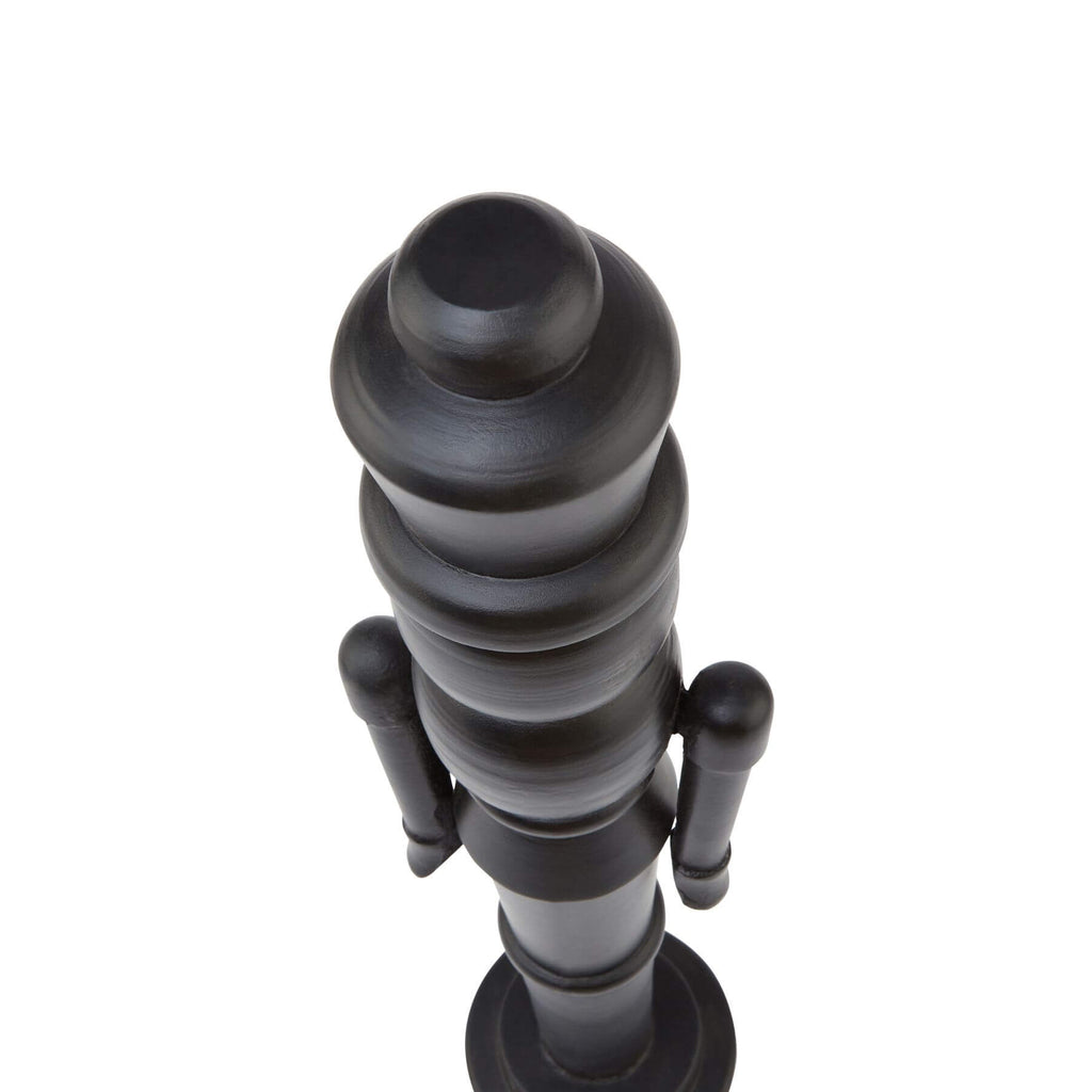 Black Scandinavian nutcracker with minimalist design, 60cm tall, matte wood finish, modern Christmas decor statement piece by Sostter at brixbailey.com