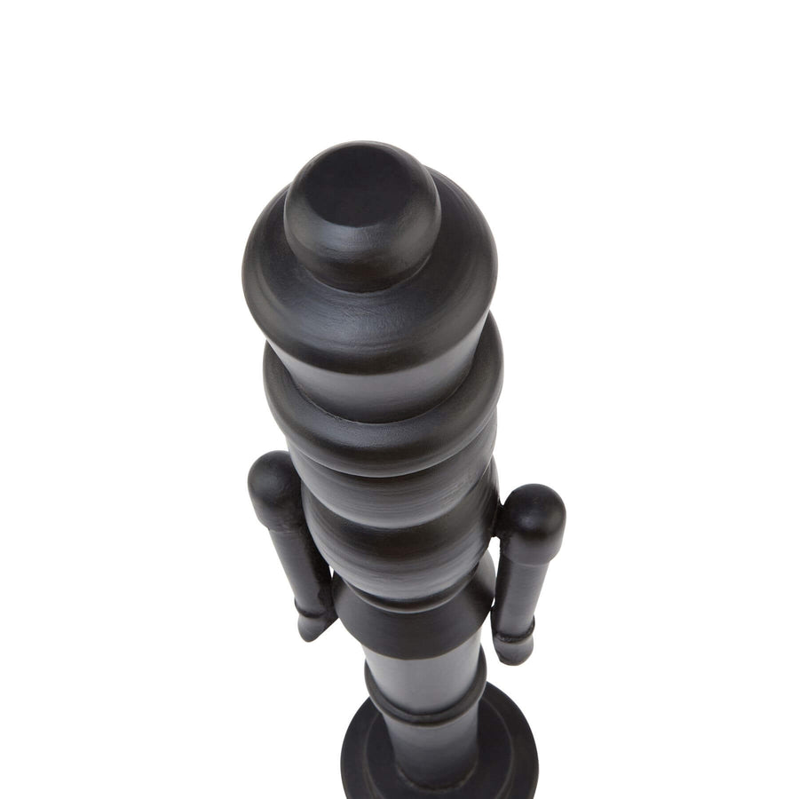 Black Scandinavian nutcracker with minimalist design, 60cm tall, matte wood finish, modern Christmas decor statement piece by Sostter at brixbailey.com