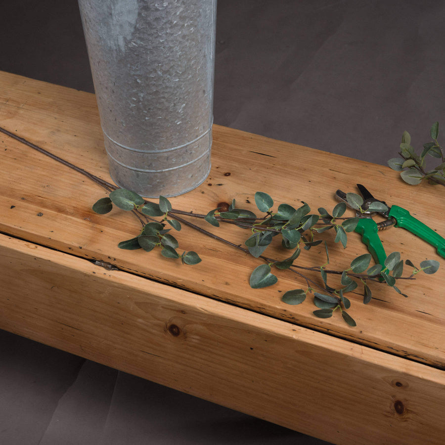 Tall faux eucalyptus stem with realistic green leaves, perfect for floor vases and home decor by Sostter at brixbailey.com