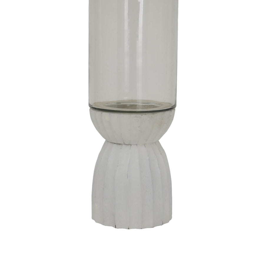White carved glass hurricane lantern with intricate geometric patterns, warm atmospheric glow by Sostter at brixbailey.com