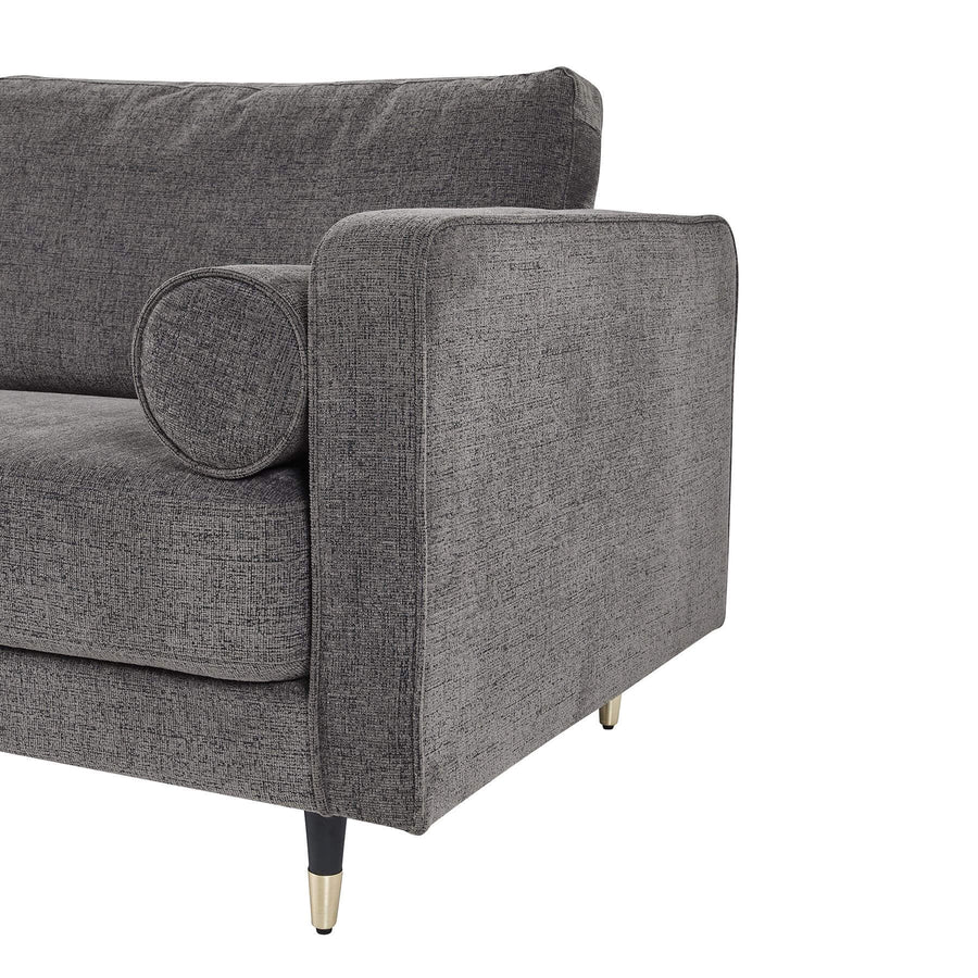 Grey fabric armchair with plush upholstery and curved arms, blending modern elegance with classic comfort for any living space. by Sostter at brixbailey.com
