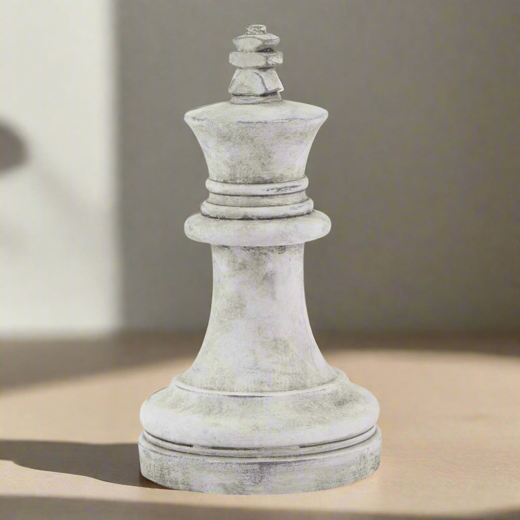Handcrafted white ceramic chess king with matte finish, 28cm tall, showcasing artisan stone textures and elegant detailing. by Sostter at brixbailey.com