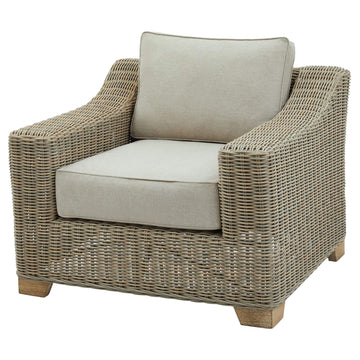 Beige outdoor armchair with HDPE wicker weave, powder-coated aluminum frame, and acacia wood feet. by Sostter at brixbailey.com