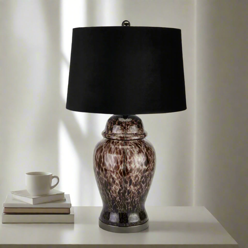 Handcrafted black and grey dappled glass table lamp with velvet shade, casting dynamic light patterns in modern decor. by Sostter at brixbailey.com