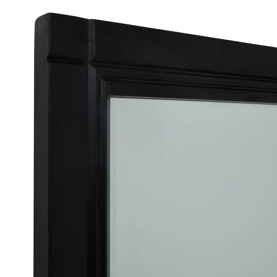 Oversized Georgian-style window mirror with deep ebony wood frame and grid detailing, enhancing light and space by Sostter at brixbailey.com