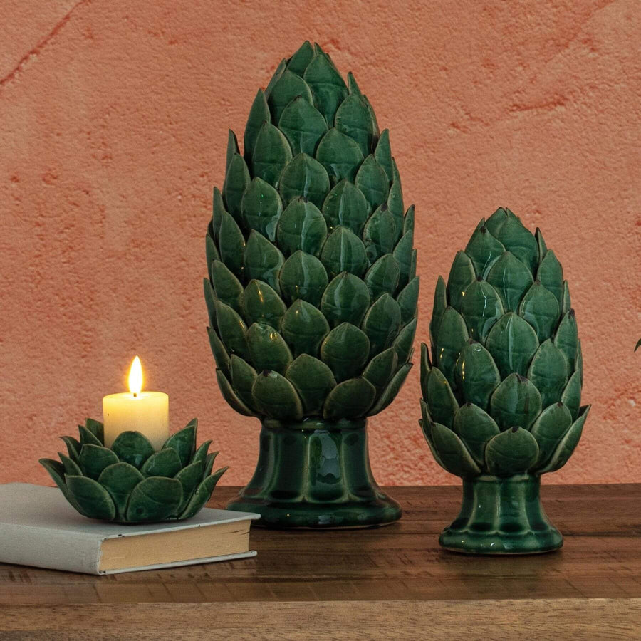 Handcrafted ceramic tea light holder with artichoke cutouts, botanical green glaze, casting enchanting shadow patterns. by Sostter at brixbailey.com