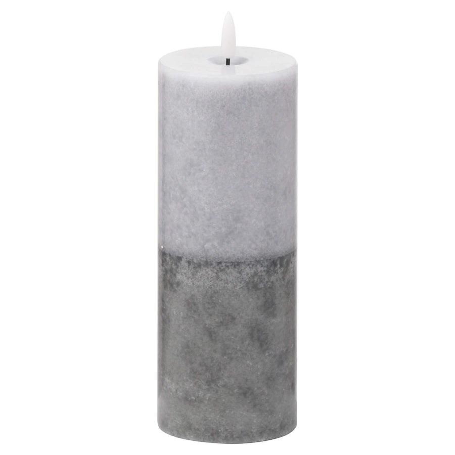 Handcrafted LED candle with realistic wax texture and two-tone stone finish, emitting warm amber glow for flameless ambiance. by Sostter at brixbailey.com