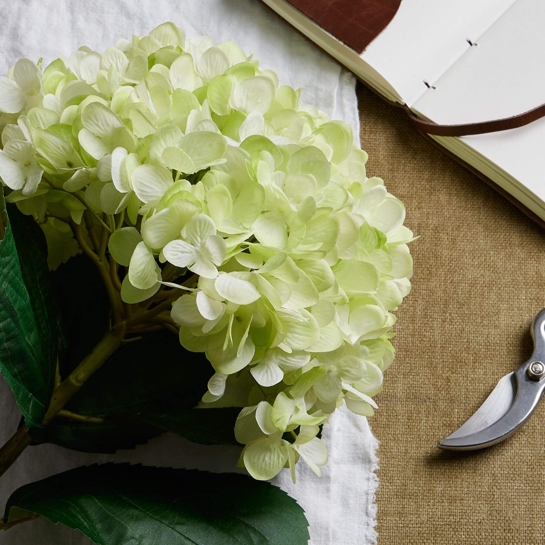 Lifelike oversized green hydrangea arrangement with hand-painted petals, perfect for home decor  by Sostter at brixbailey.com