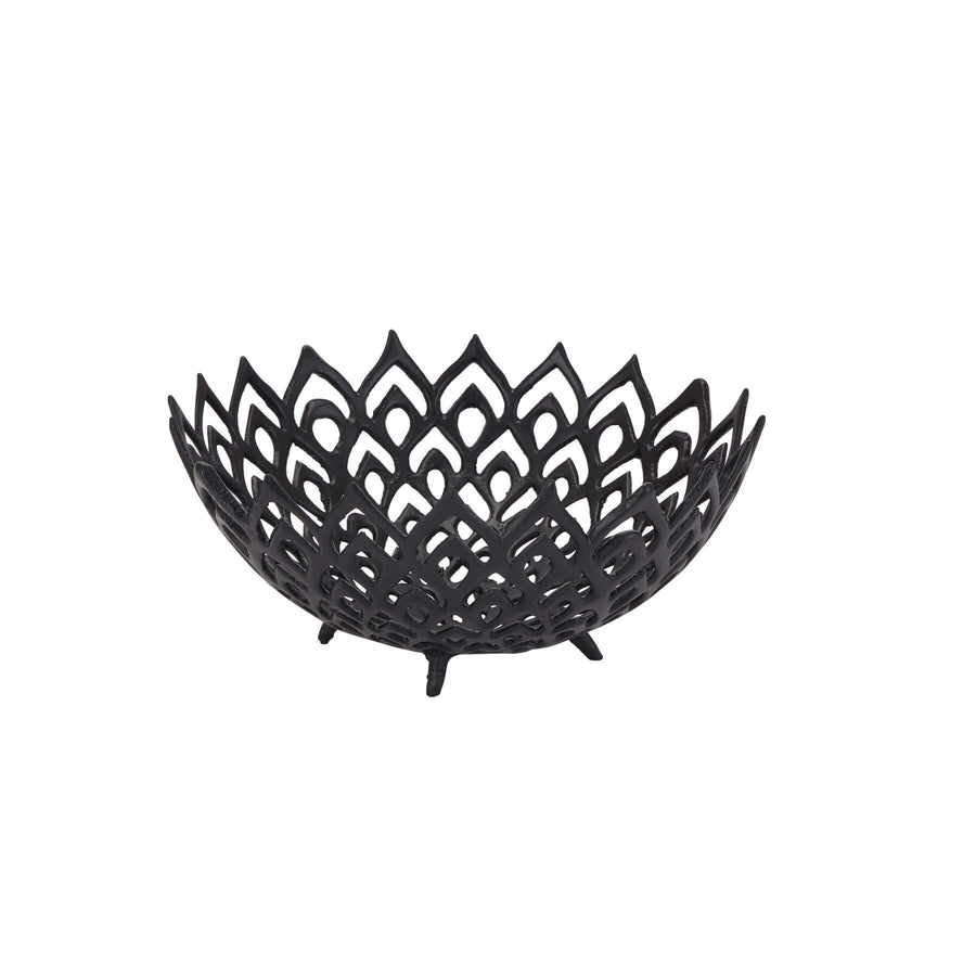 Matte black perforated steel bowl with intricate lattice design, casting dynamic light and shadow patterns by Sostter at brixbailey.com