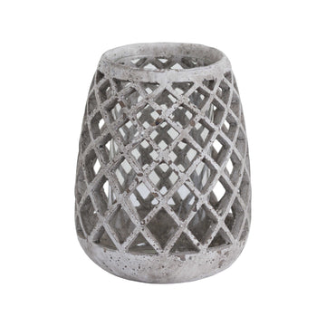 Large conical ceramic lattice hurricane lantern in natural stone, emitting soft light patterns through decorative cutouts. by Sostter at brixbailey.com