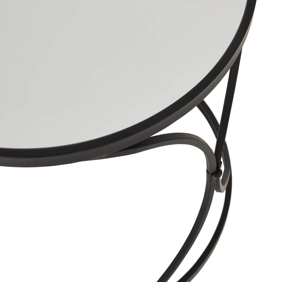 Black metal nesting side tables with mirrored glass surfaces, modern accent furniture for stylish home decor. by Sostter at brixbailey.com