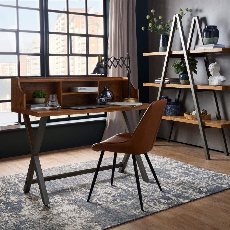 Modern Scandinavian dining chair in warm brown faux leather with black metal legs, minimalist design. by Sostter at brixbailey.com