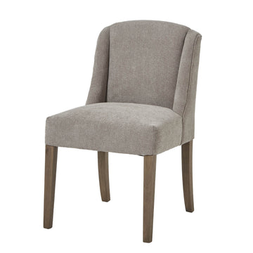 Handwoven taupe dining chair with solid wood frame, ergonomic curved silhouette, and dark wood accents. by Sostter at brixbailey.com