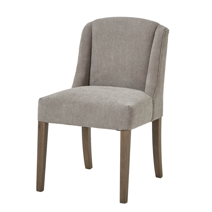 Handwoven taupe dining chair with solid wood frame, ergonomic curved silhouette, and dark wood accents. by Sostter at brixbailey.com