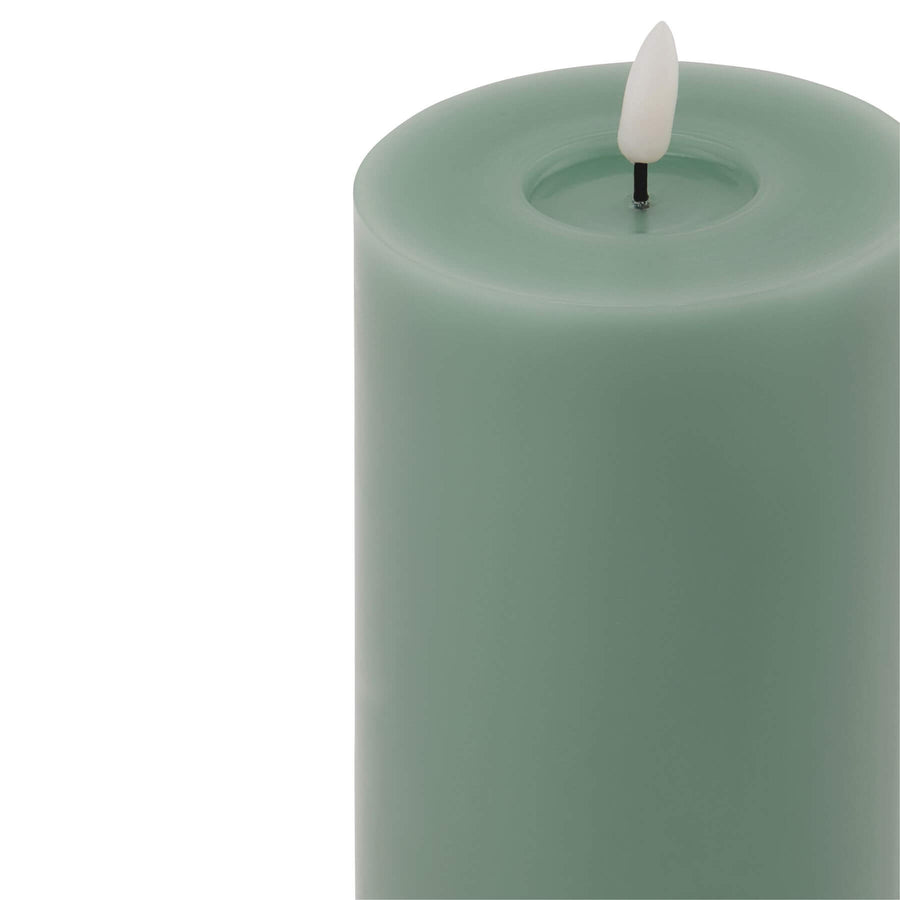 Realistic sage LED wax candle with flickering flame effect for flameless ambiance, battery-powered home decor by Sostter at brixbailey.com