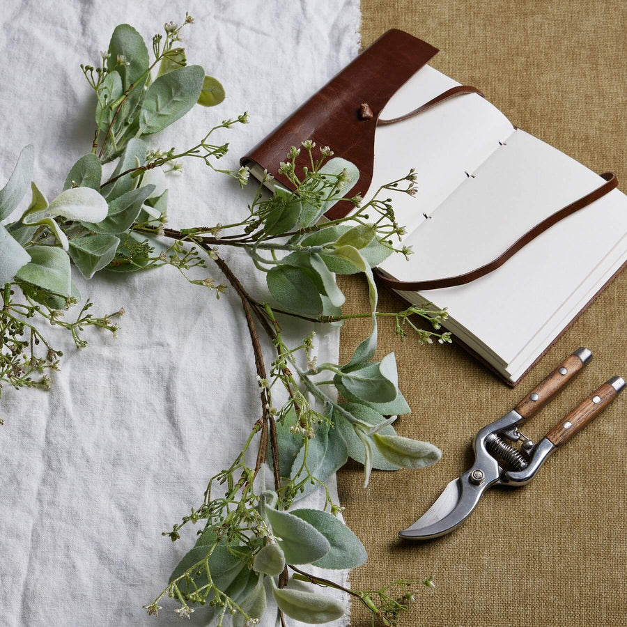 Elegant winter garland with lamb's ear foliage and wax flowers in soft grey and green tones, 153cm long by Sostter at brixbailey.com