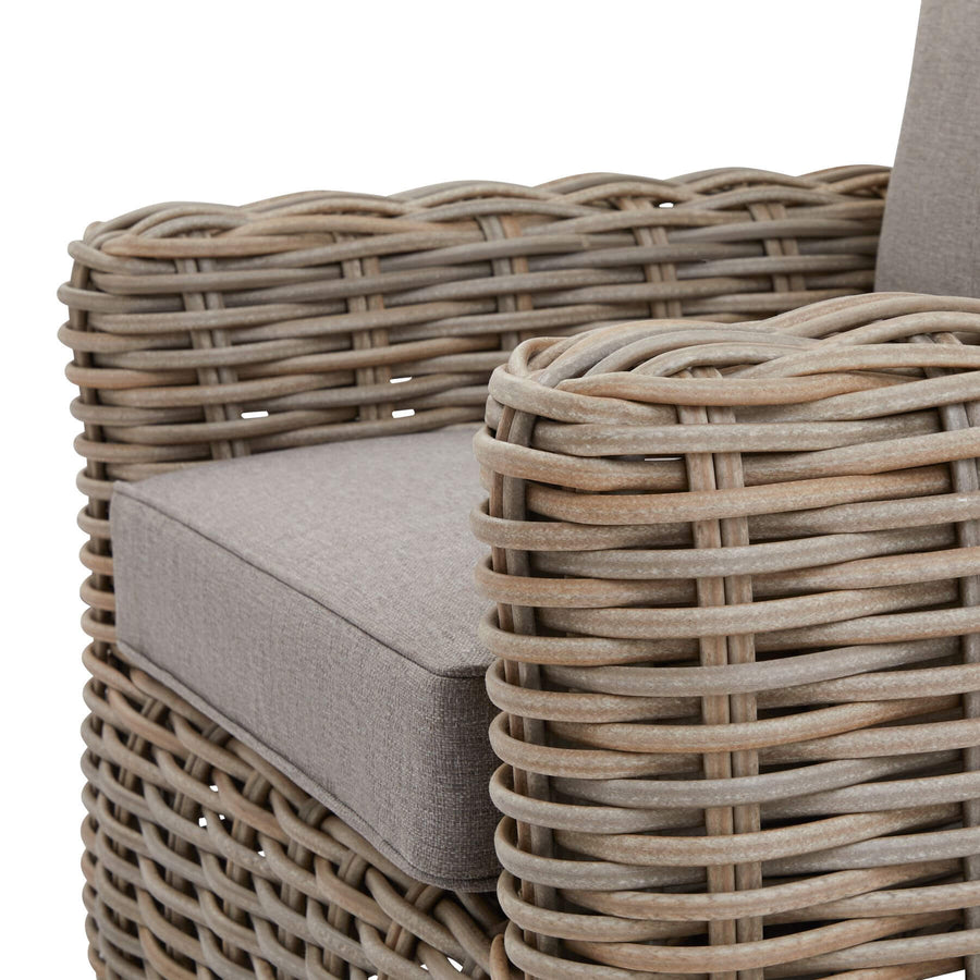 Premium beige outdoor wicker set with Olefin cushions and acacia wood coffee table by Hill Interiors at brixbailey.com