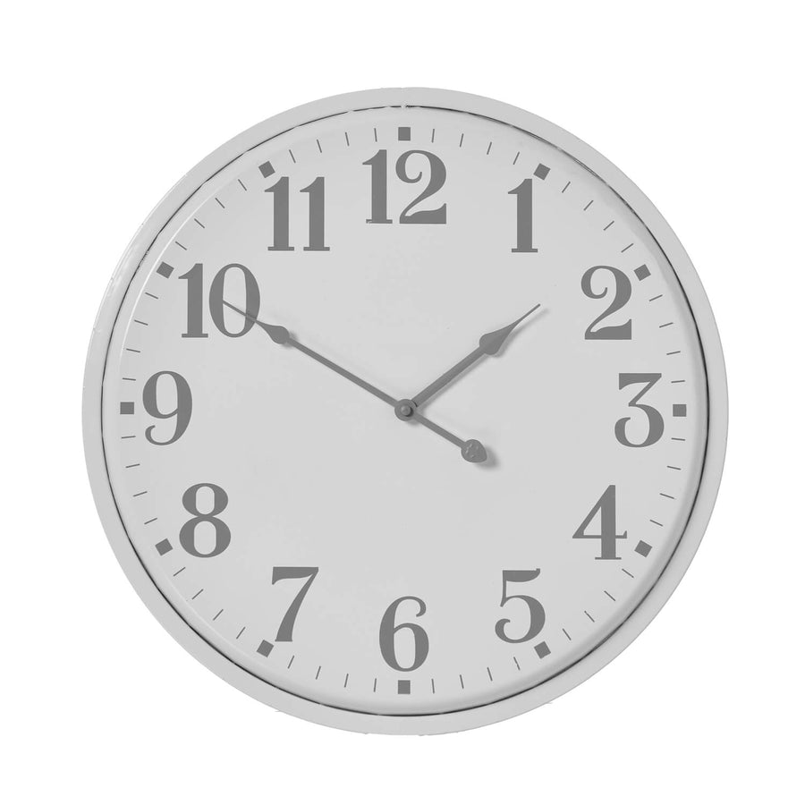 Modern white metal wall clock with bold circular design, perfect for minimalist or industrial interiors  by Sostter at brixbailey.com