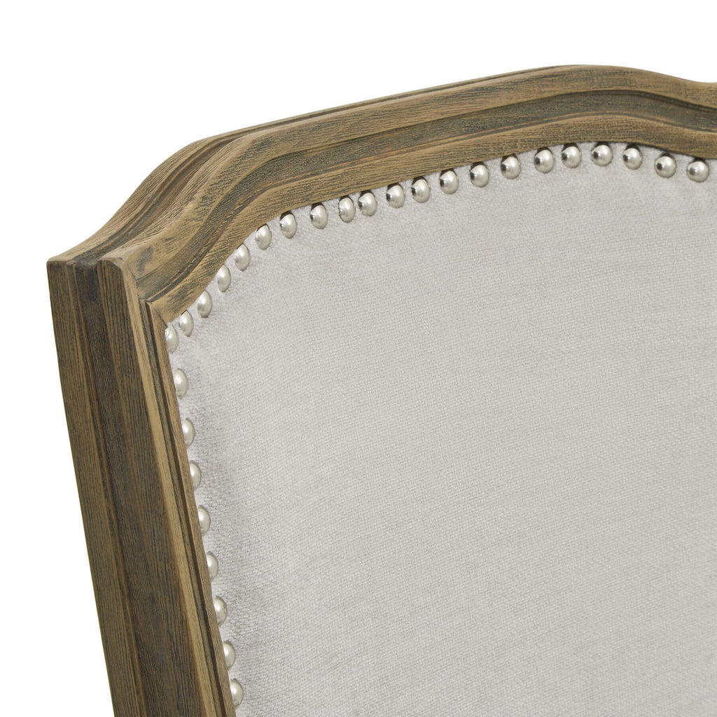Ripley grey dining chair with handcarved rubberwood frame and neutral woven upholstery, ergonomic design for comfort. by Sostter at brixbailey.com