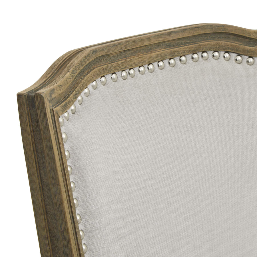 Ripley grey dining chair with handcarved rubberwood frame and neutral woven upholstery, ergonomic design for comfort. by Sostter at brixbailey.com
