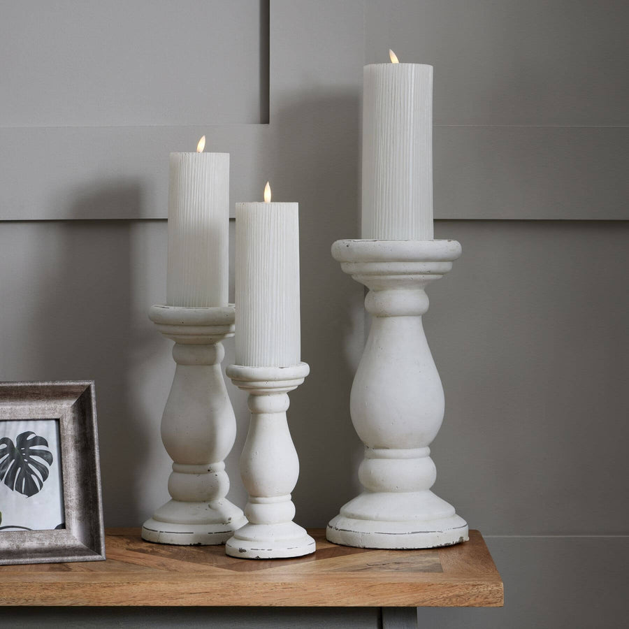 Handcrafted matte white ceramic candle holder with minimalist design, soft light diffusion, and elegant texture. by Sostter at brixbailey.com