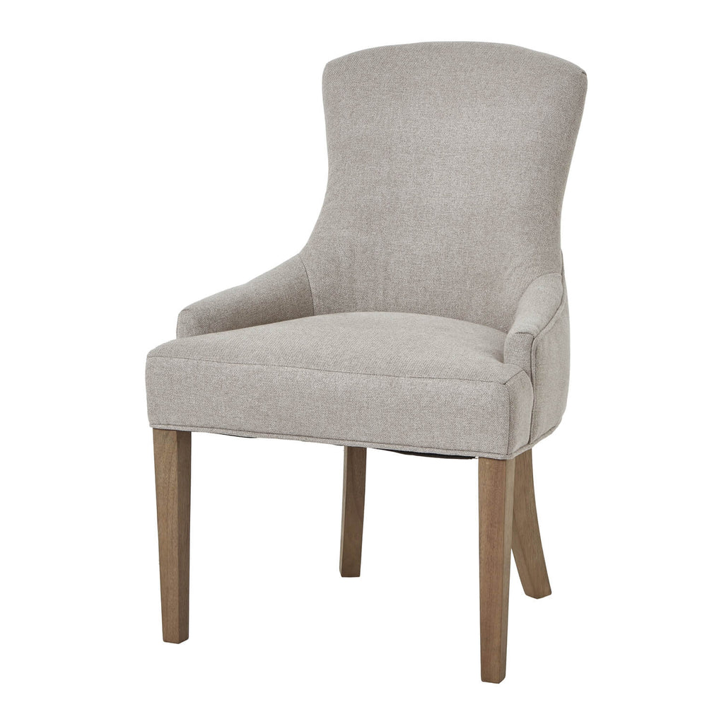 Oatmeal twill dining chair with tufted detailing, curved back, and solid oak legs for elegant comfort. by Sostter at brixbailey.com