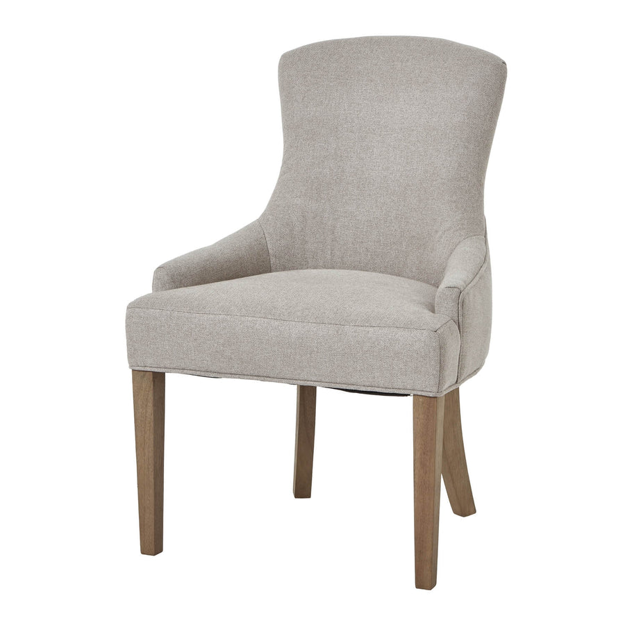 Oatmeal twill dining chair with tufted detailing, curved back, and solid oak legs for elegant comfort. by Sostter at brixbailey.com