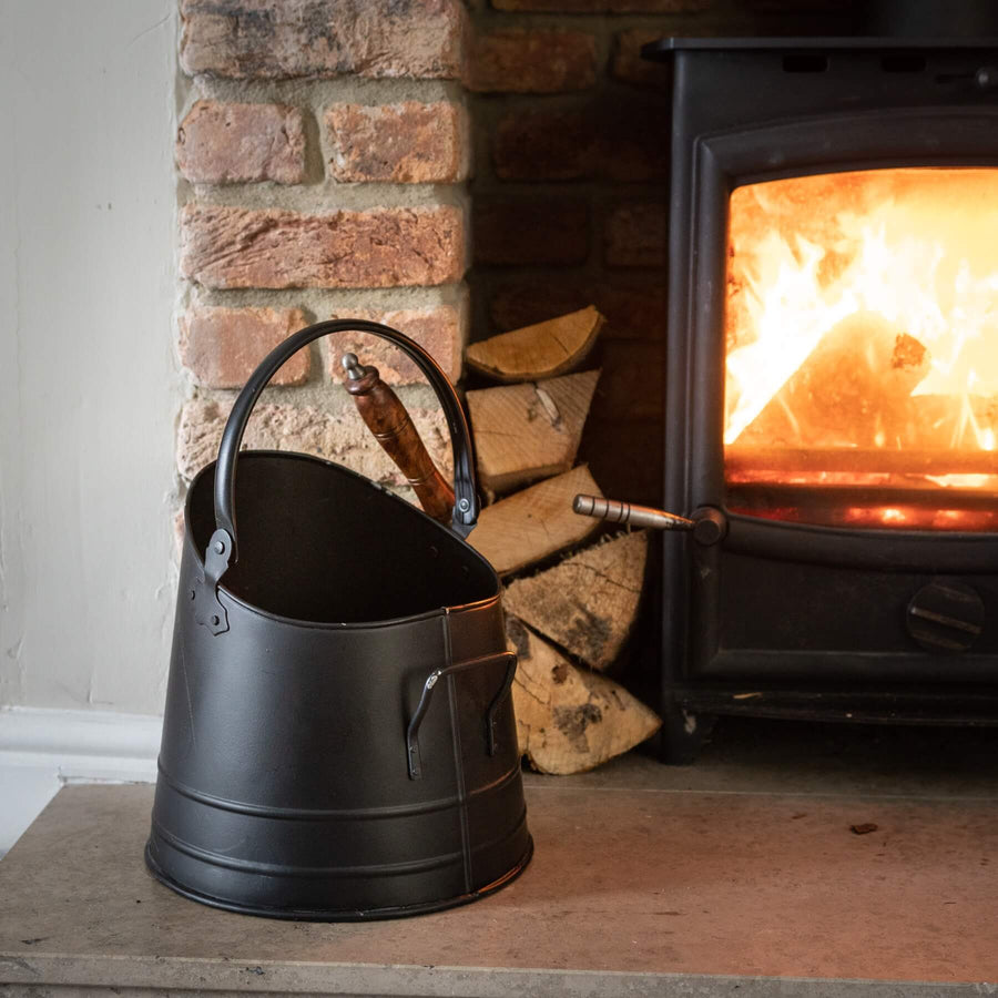 Handcrafted black steel coal bucket with wooden shovel, rustic vintage decor for farmhouse or industrial interiors. by Sostter at brixbailey.com