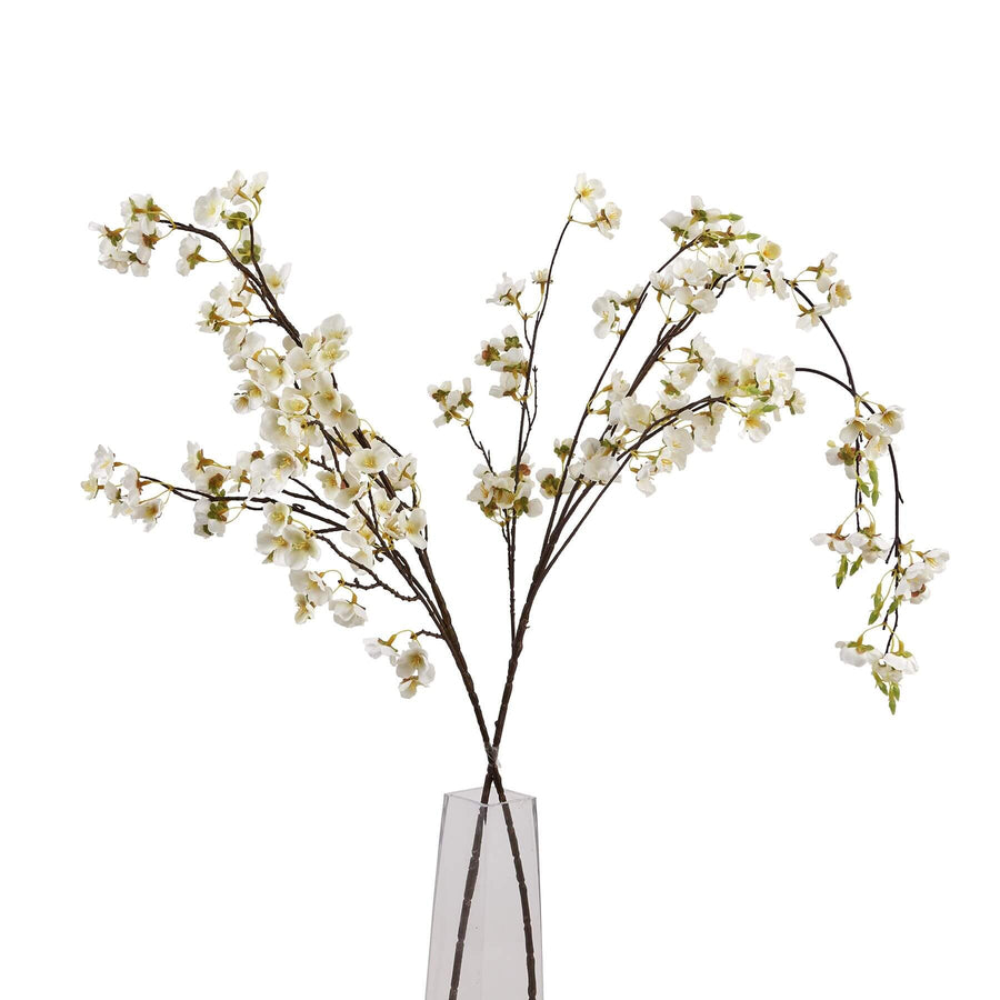 White Japanese-inspired artificial blossom stem, hyper-realistic floral decor, 130cm tall with natural branch details by Sostter at brixbailey.com