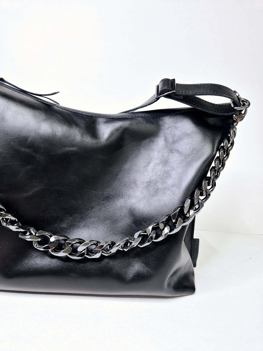 Classic Black Handbag: Timeless Elegance Meets Modern Versatility by Zelma Kraft at brixbailey.com